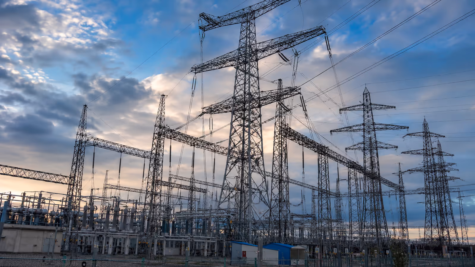 High-voltage transmission towers at an electrical substation